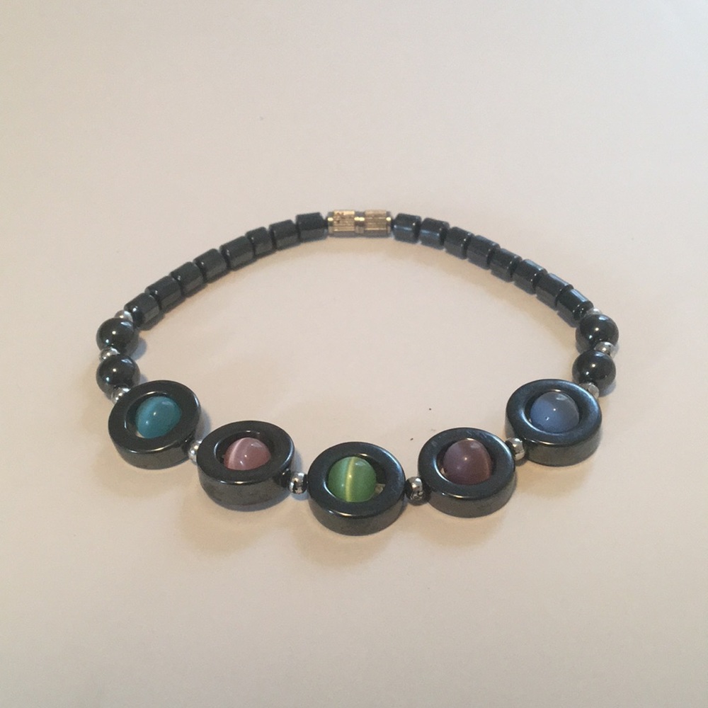 Charcoal grey stone w/colored stones